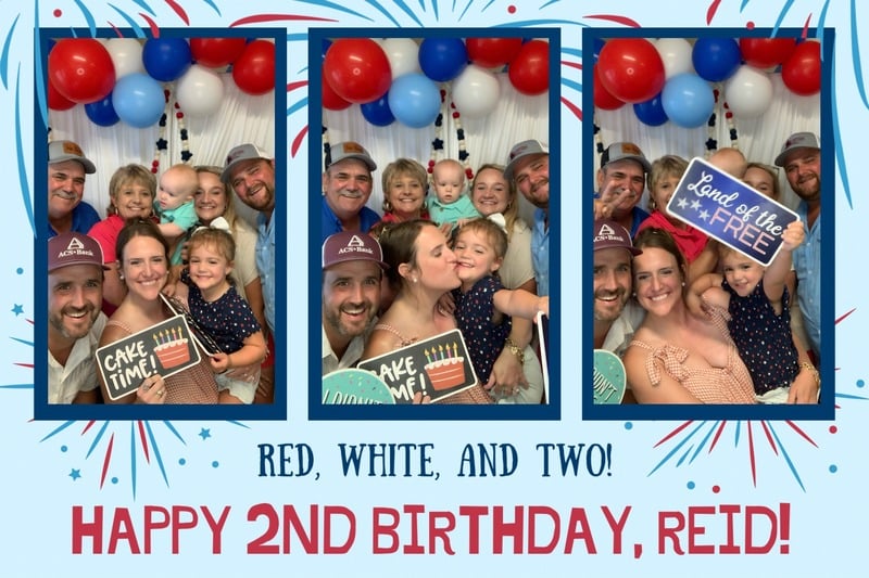 Large group celebrating at a birthday or anniversary with props